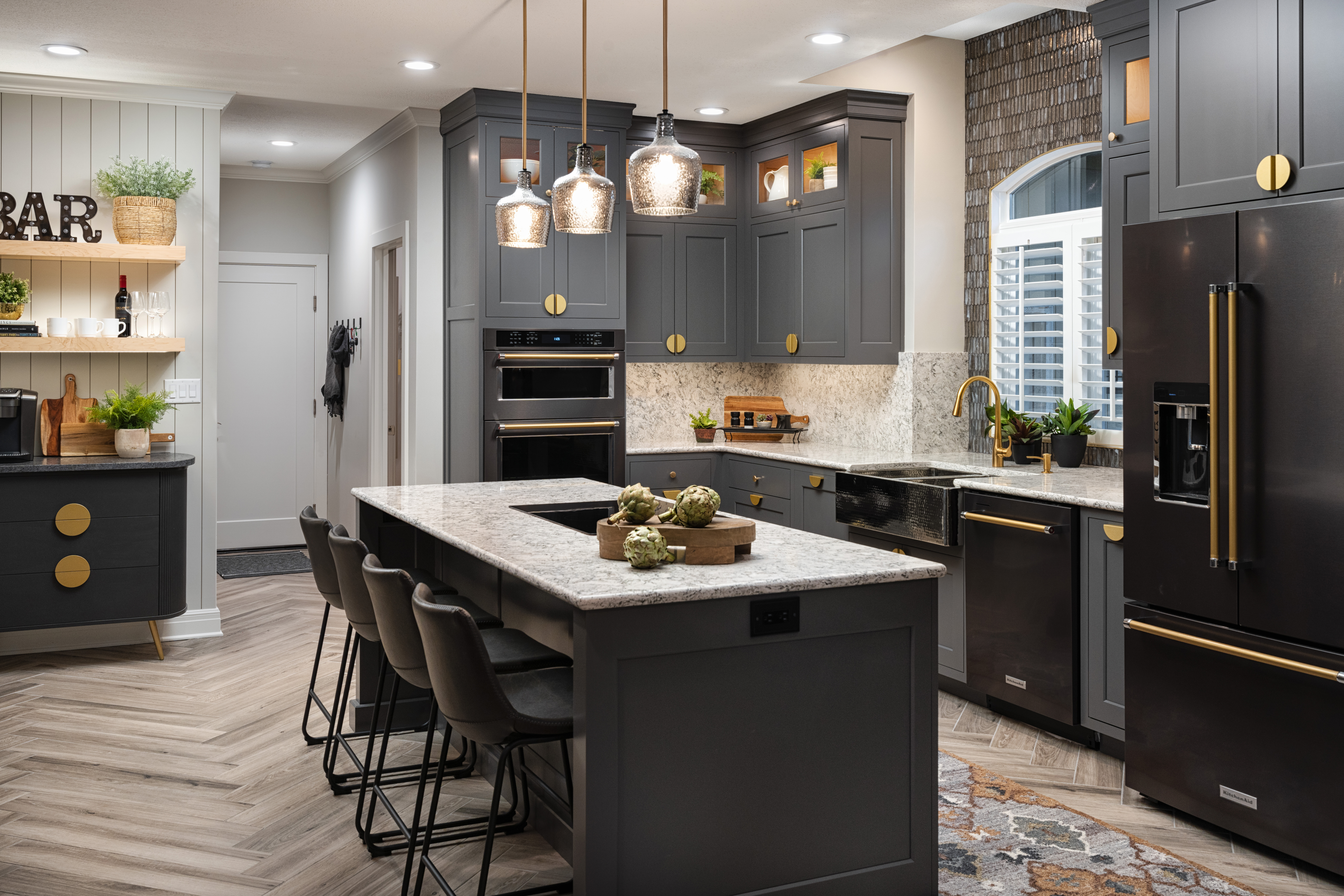 Newly Remodeled Kitchen With Island, Black Cabinets, and Black Appliances