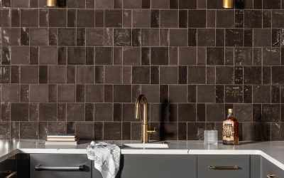 New Remodeled Basement with gray cabinets and gold faucet